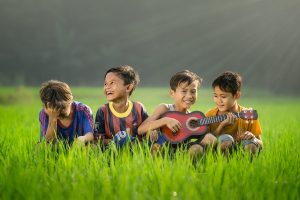 Kids enjoying music. Photo by Robert Collins on Unsplash